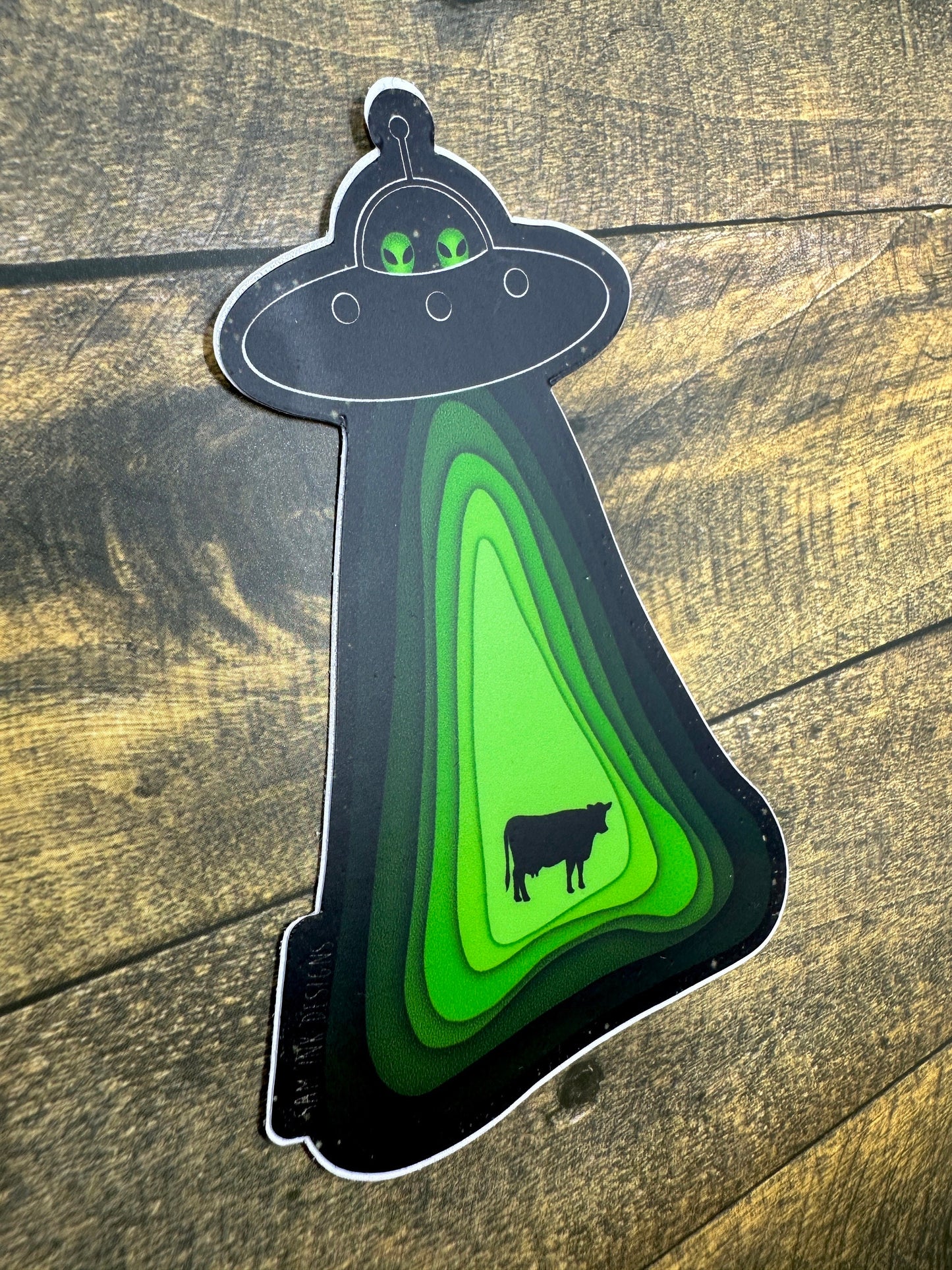 Alien Sticker Flying Soaceship and Abducting a Cow Waterproof Decal, Water Bottle, and Laptop Stickers